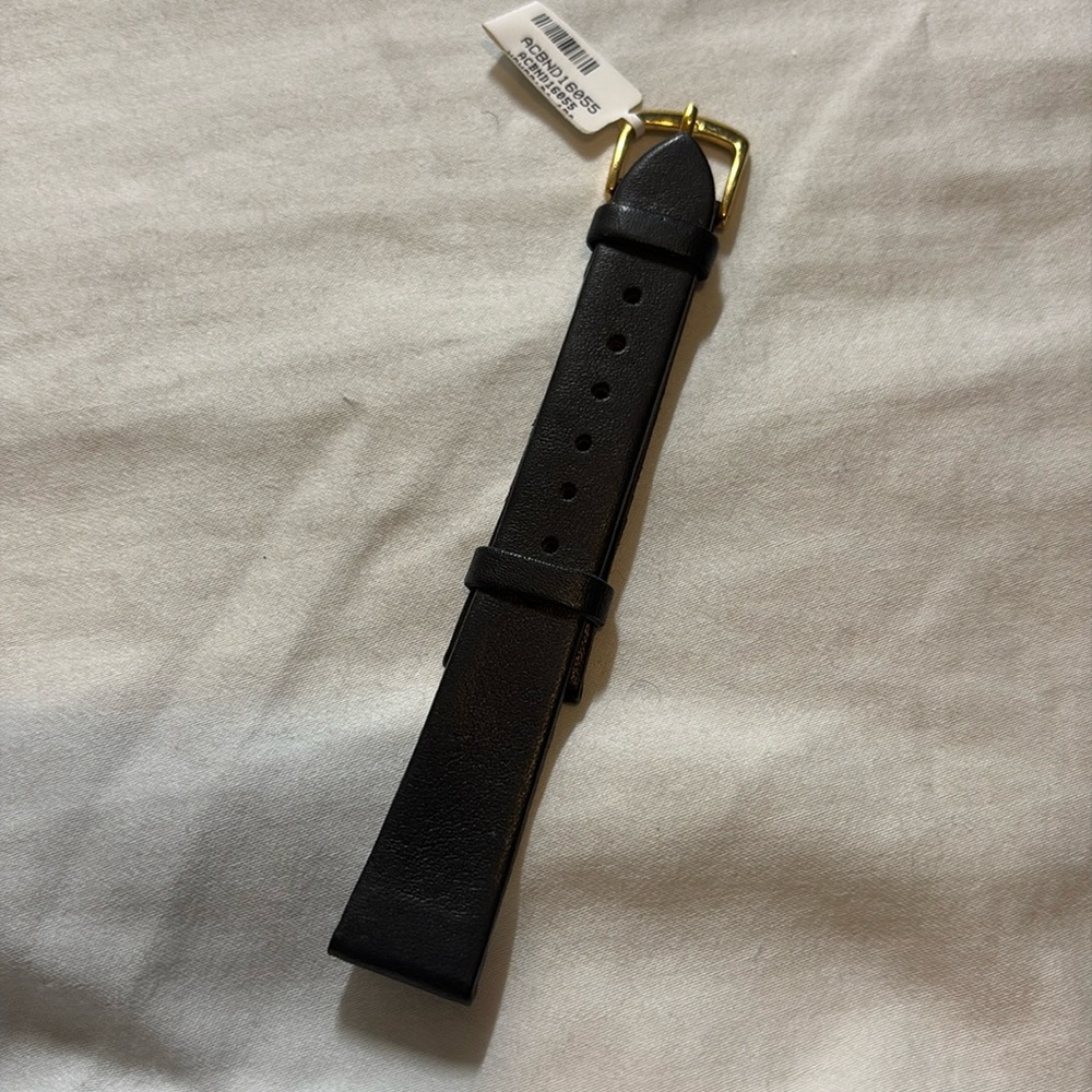 Genuine Calfskin NWT black watch band with a gold tone buckle.